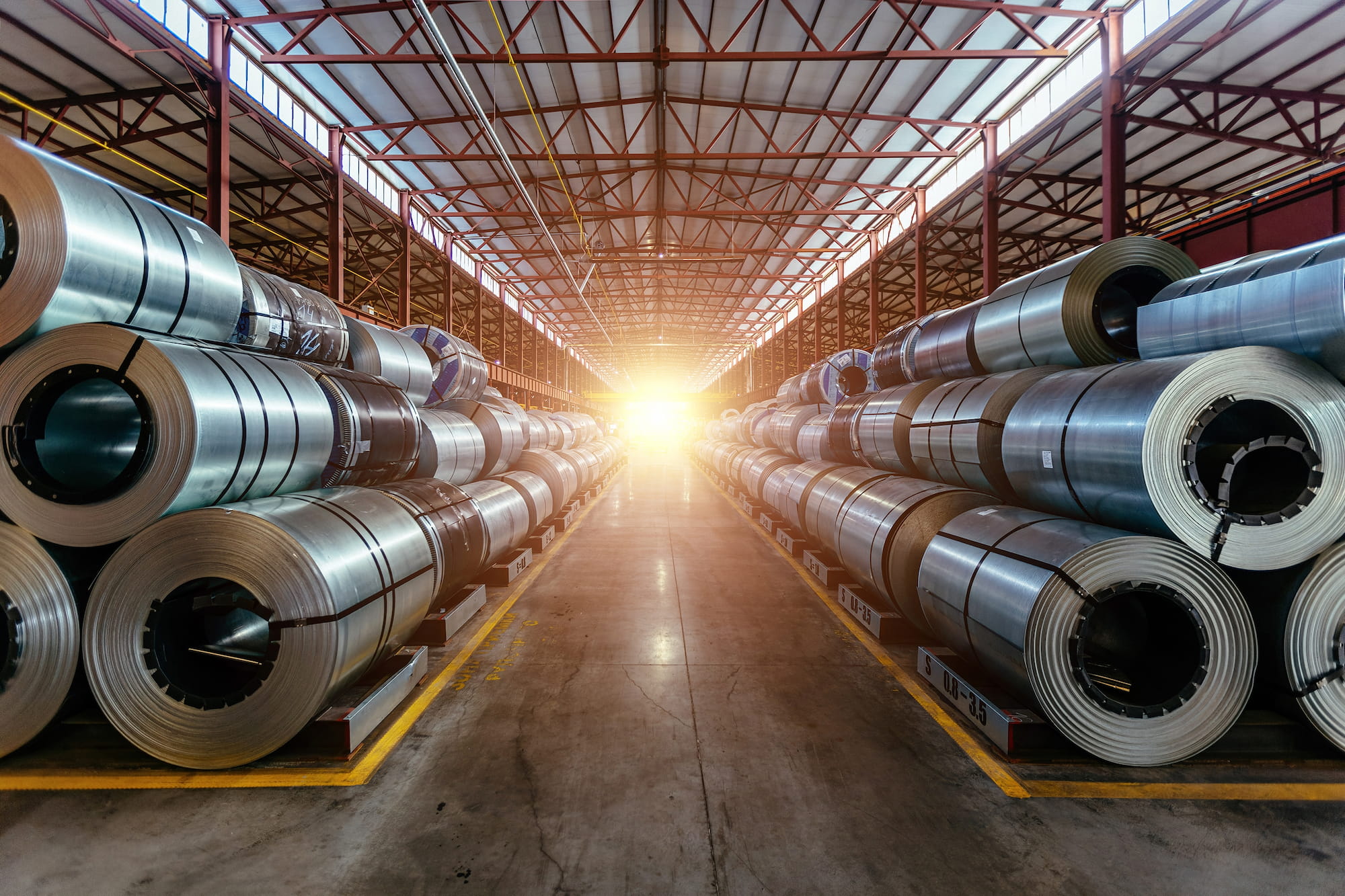 Rolls of galvanised steel in a warehouse